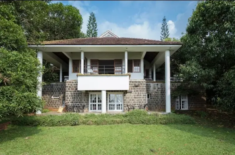 Side exterior surrounded by greenery